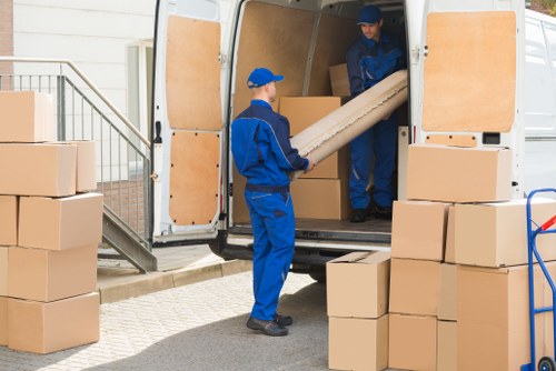 Man with van moving boxes in Battersea street