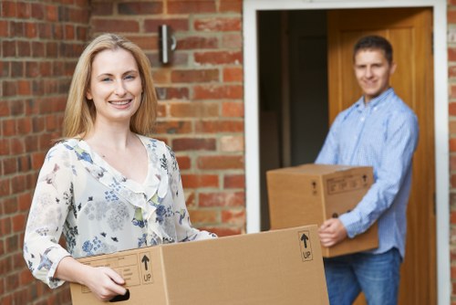 Professional movers working in a Battersea home
