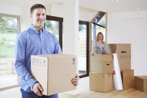 Team handling boxes and household items near Battersea