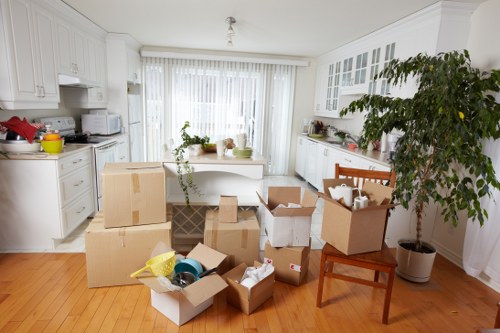 Packed boxes and furniture ready for removal van transport