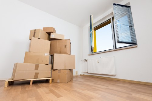 Staff securing boxes safely inside a moving van
