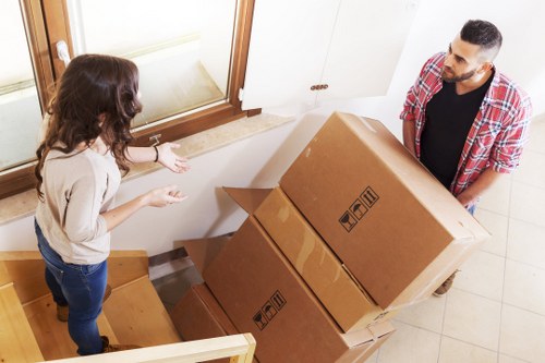 Professional movers loading furniture in Battersea