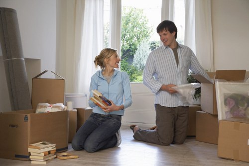 Professional movers handling furniture during a flat removal