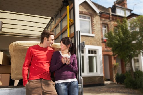 Removalists loading boxes and furniture for a local Battersea move